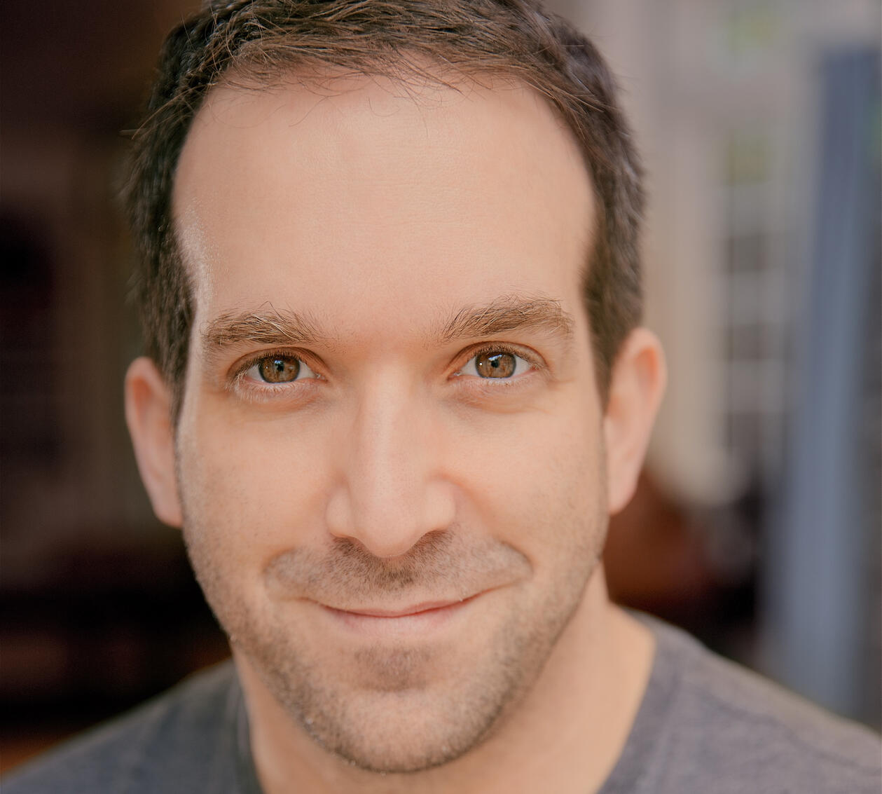 Headshot photo of David August